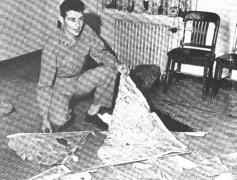 Irving Newton holding weather balloon debris